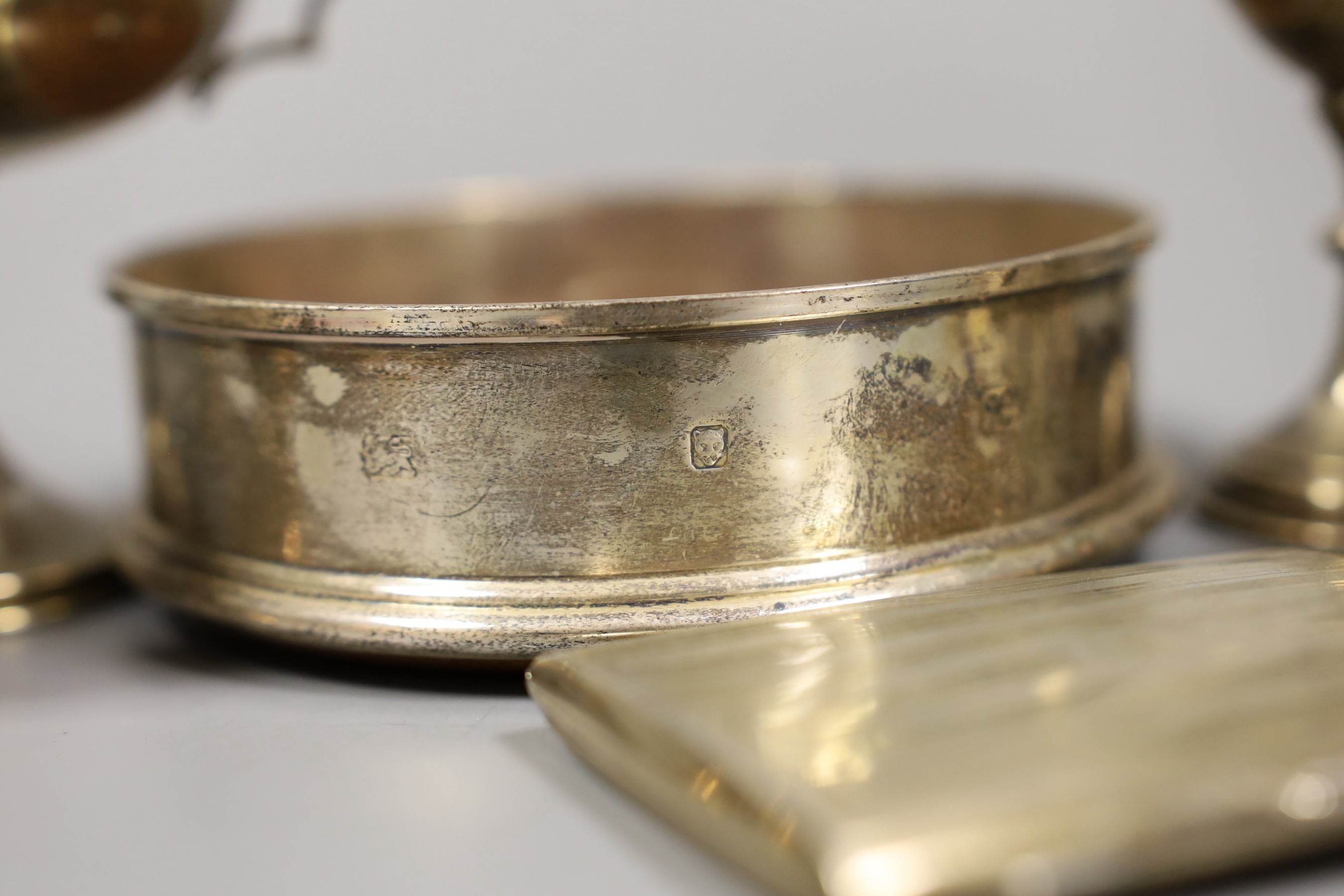 Sundry small silver including a modern wine coaster, a pair of Irish pierced silver salts(a.f.), two goblets, two small trophy cups and a cigarette case.